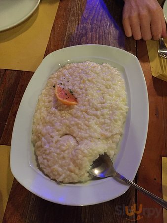 Risotto agli agrumi e dolce al cucchiaio con cioccolato e mirtilli